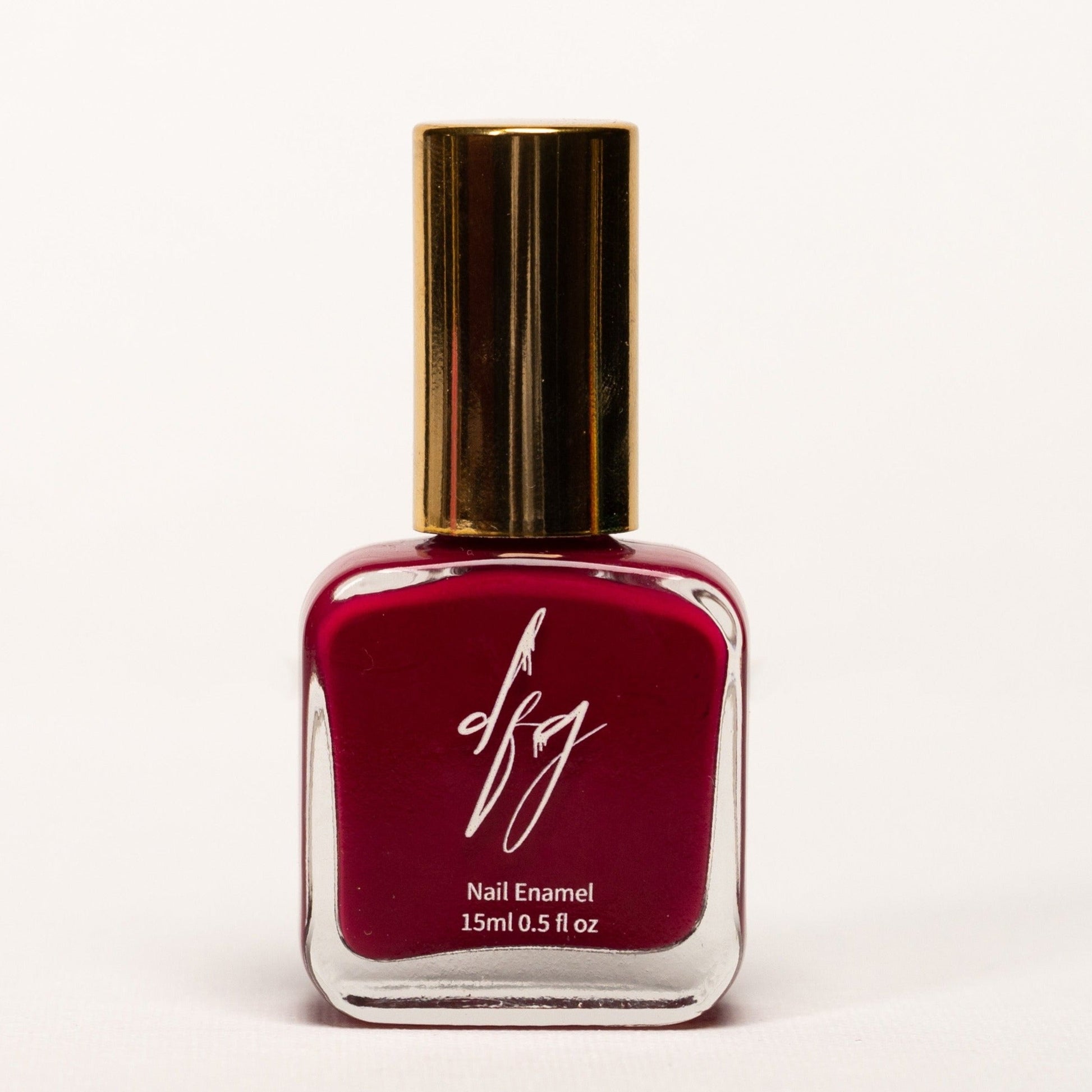 In this photo, we see a bottle of "The Divinely Rooted" Nail Polish, specially designed with inclusivity in mind. The nail polish bottle is elegantly shaped and features tactile markings on the cap, making it easily identifiable by touch. The color of the nail polish is a rich, velvety brown, representing warmth and sophistication.