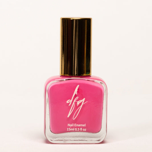 The nail polish bottle is elegantly shaped, with a smooth texture that can be easily identified by touch. The color of the nail polish is a beautiful, soft pink, reminiscent of blooming flowers and gentle femininity.